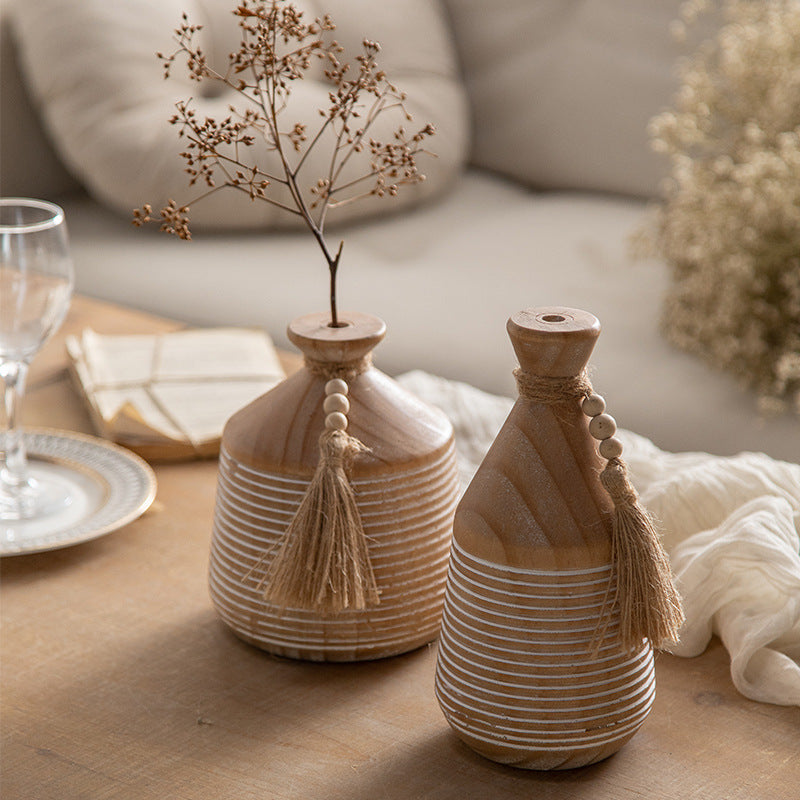 Natural wood beaded tassel vases styled with delicate dry branches
