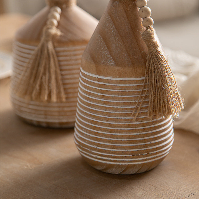 Tall natural wood bottle vase with white stripe carving and tassel