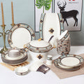 Bibo turquoise navy and gold 46-piece porcelain dinnerware set with casserole, plates, bowls and serving pieces