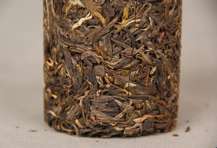 Close view of pressed Bingdao raw Pu-erh leaves