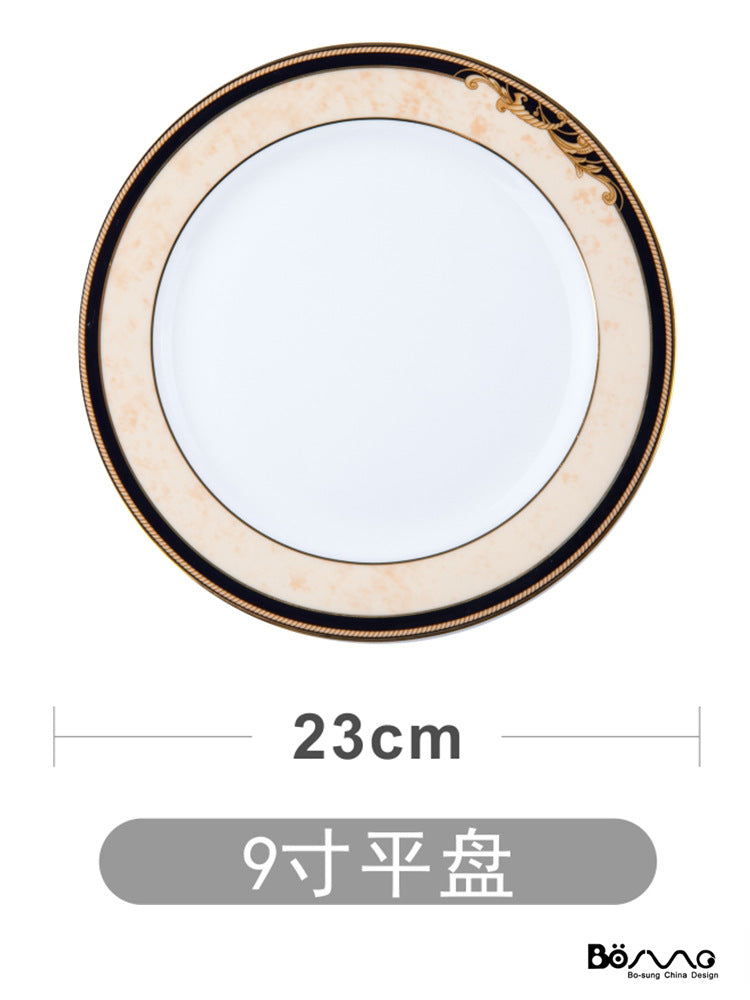 Black and gold bone china 9-inch flat plate, approximately 23 cm diameter
