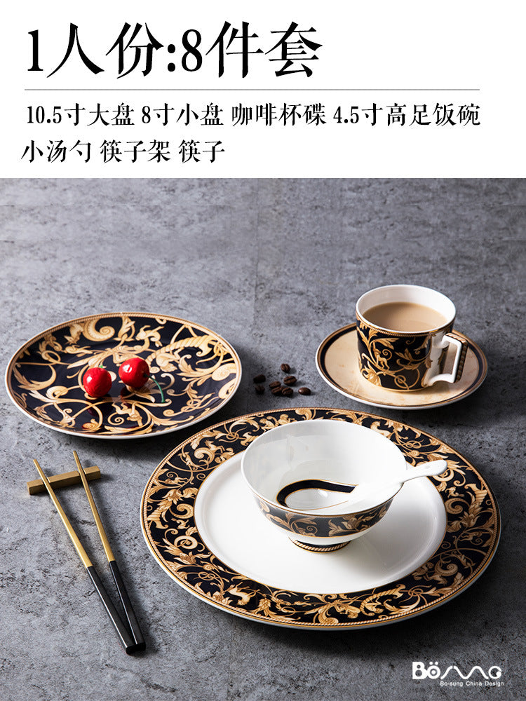 One-person eight-piece black and gold bone china place setting with plates, bowl, cup, saucer, spoon, chopsticks and chopstick rest