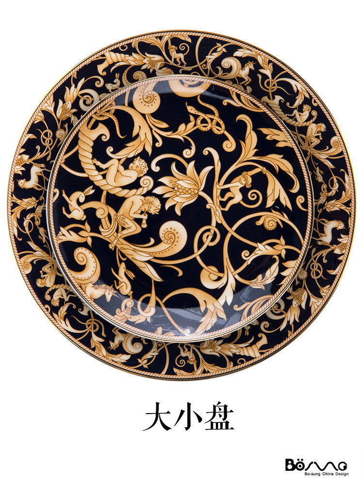 Black and gold bone china large and small plate duo with ornate animal and botanical scroll pattern
