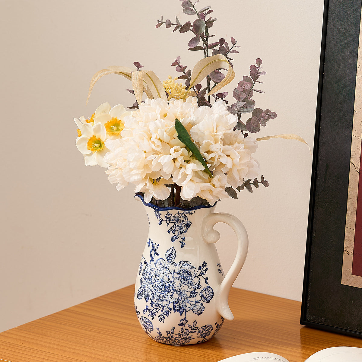 Blue peony ceramic pitcher vase styled with white flowers