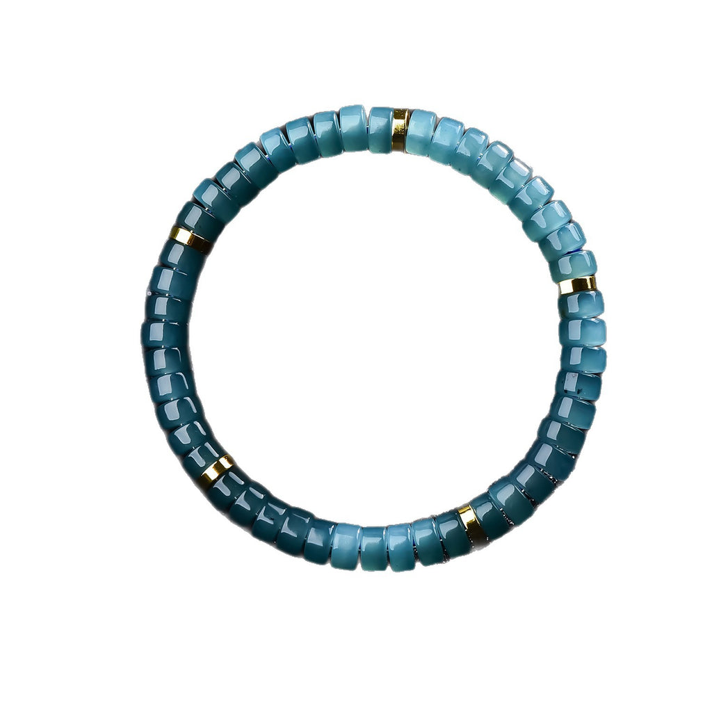 Blue water jadeite straight-cut drum bead bracelet close-up