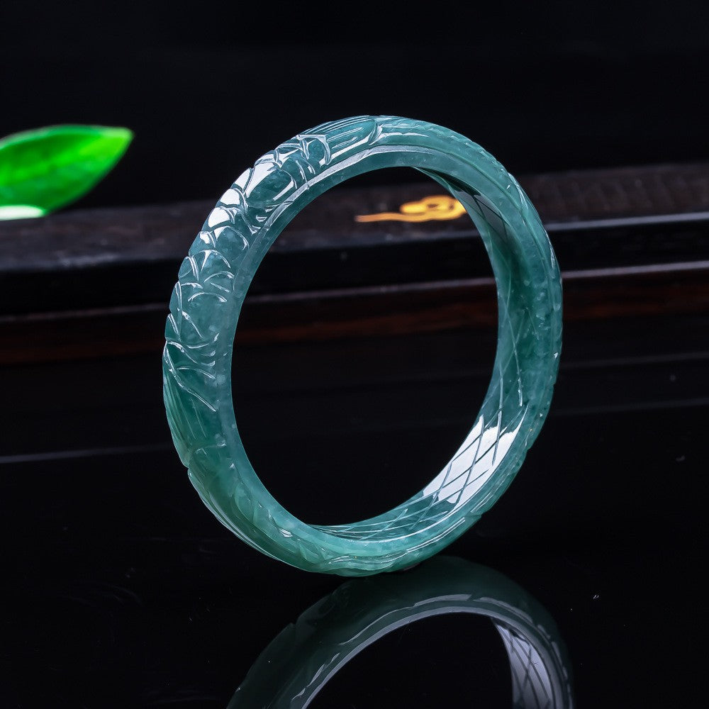 Certified blue water jadeite carved floral bangle in translucent teal-green jade