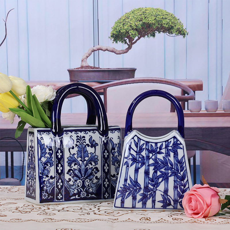 Blue and white rectangular floral and bamboo handbag vases styled together
