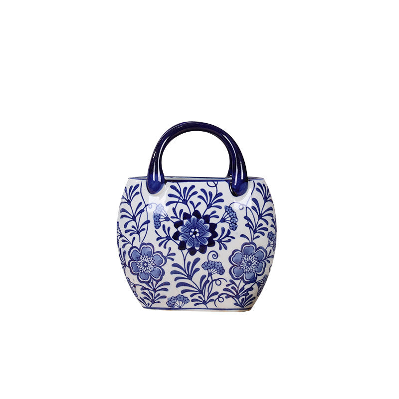 Blue and white ceramic handbag vase with round peony floral design