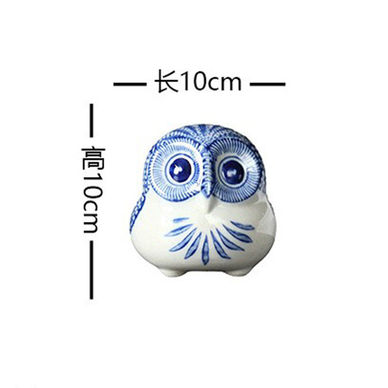 Blue and white ceramic owl figurine, small round form, 10 cm