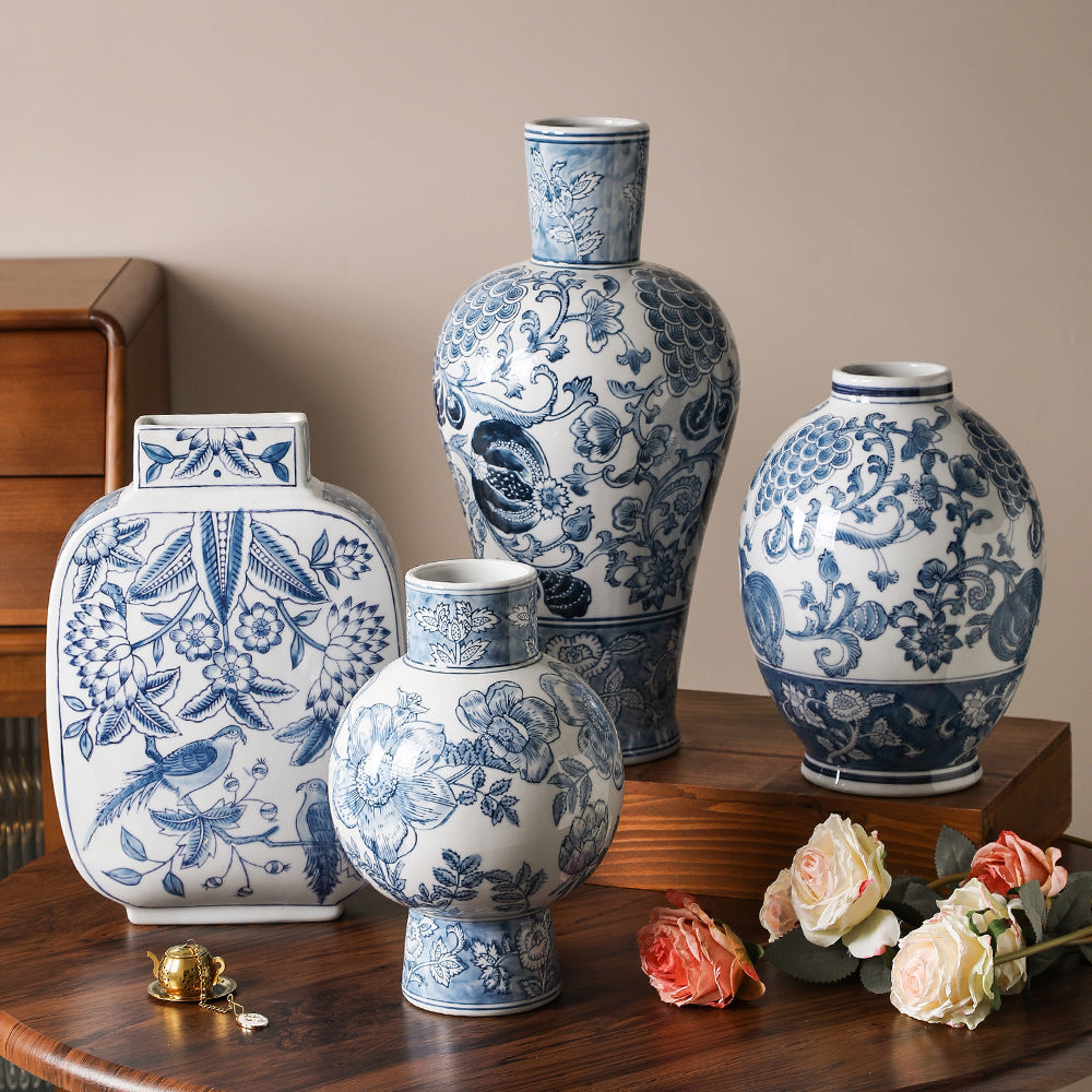 Blue and white Chinoiserie ceramic vase collection styled with flowers and dark wood