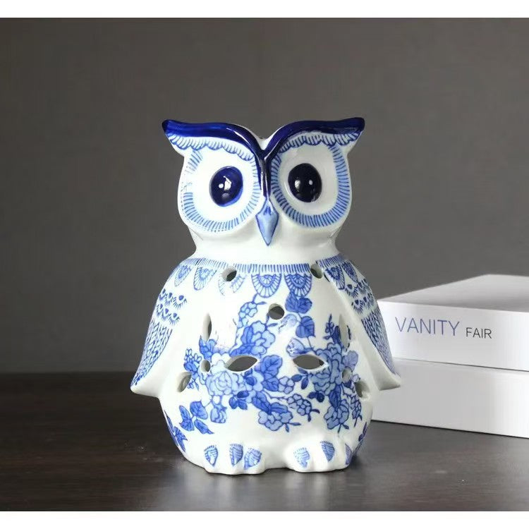 Large blue and white floral owl figurine styled on books