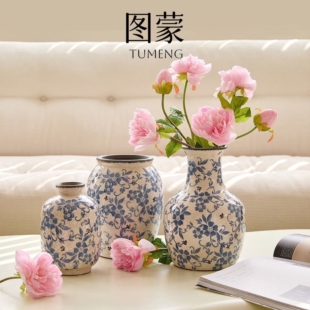 Blue and white floral ceramic vase collection styled with pink roses