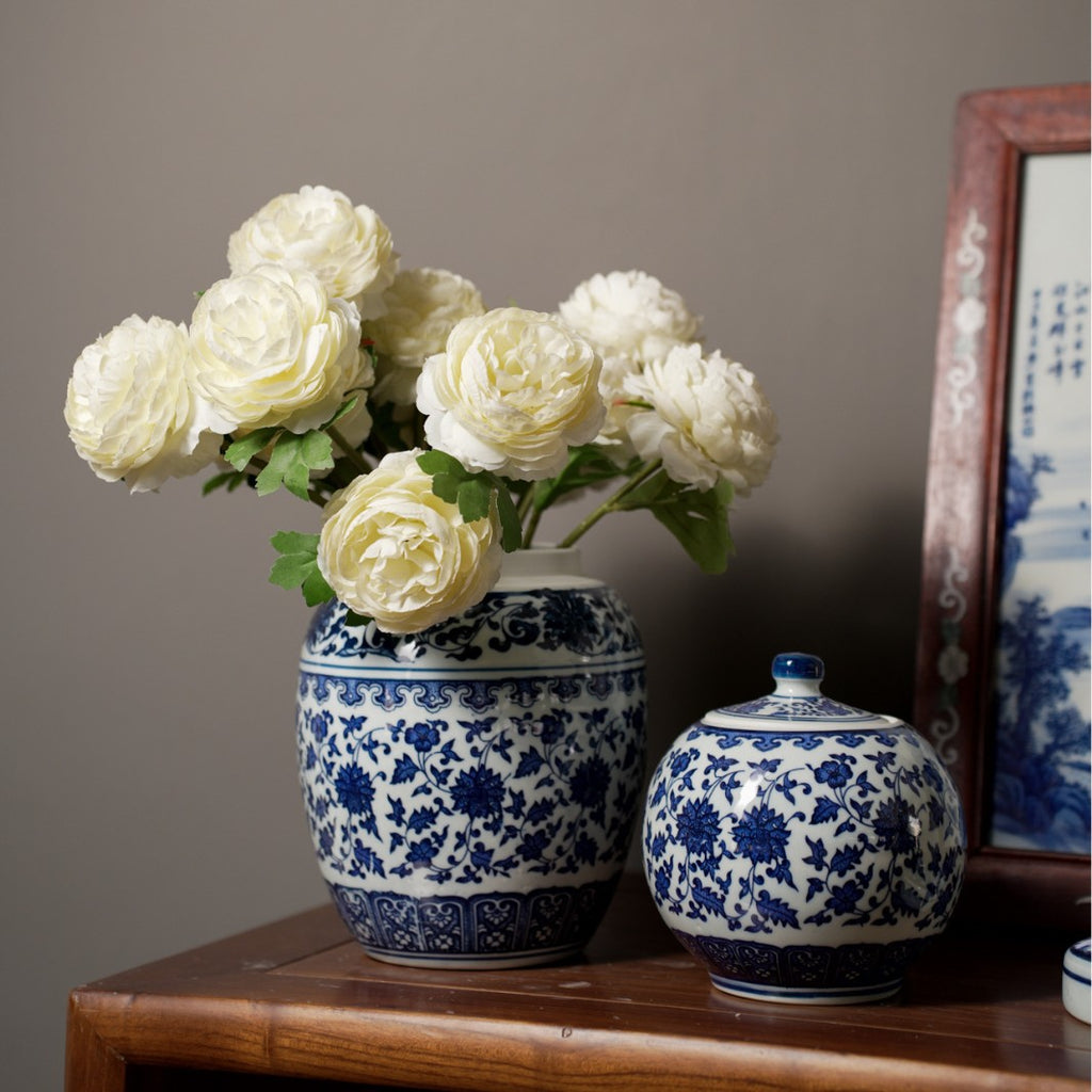 Blue and white ceramic vases styled with white flowers