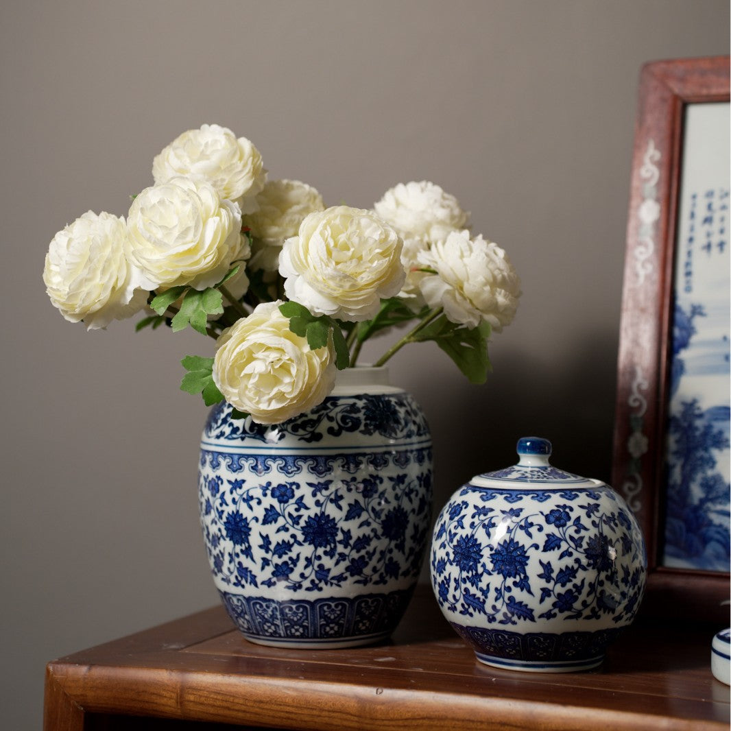 Blue and white ceramic vases styled with white flowers