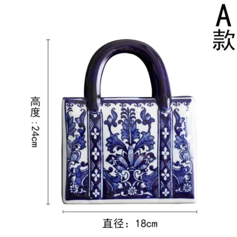 Blue and white rectangular floral ceramic handbag vase, 24 cm high