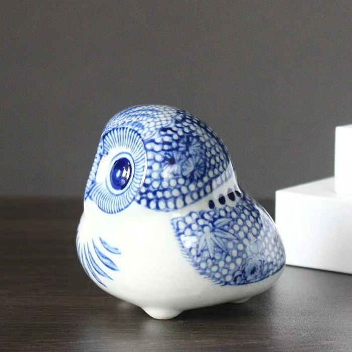 Blue and white round owl ceramic figurine side view