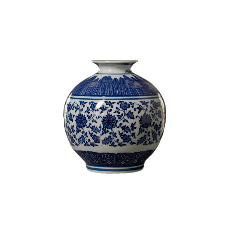 Blue and white rounded open ceramic vase on white background