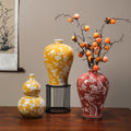 Blue and white, yellow and wine-red Chinese vase collection styled with branches