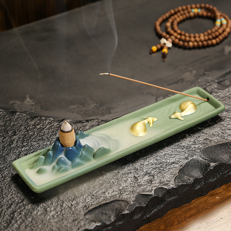 Celadon Fortune-Turning Bull long ceramic incense tray with mountain landscape