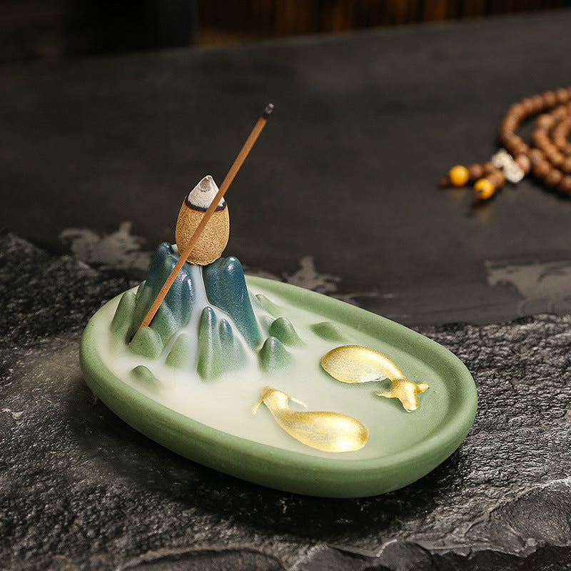 Celadon Fortune-Turning Bull round ceramic incense holder with mountain smoke effect