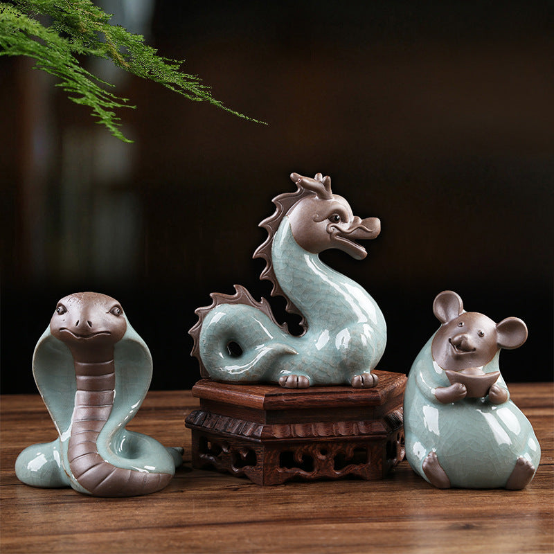 Celadon Chinese zodiac tea pets grouped on tea table