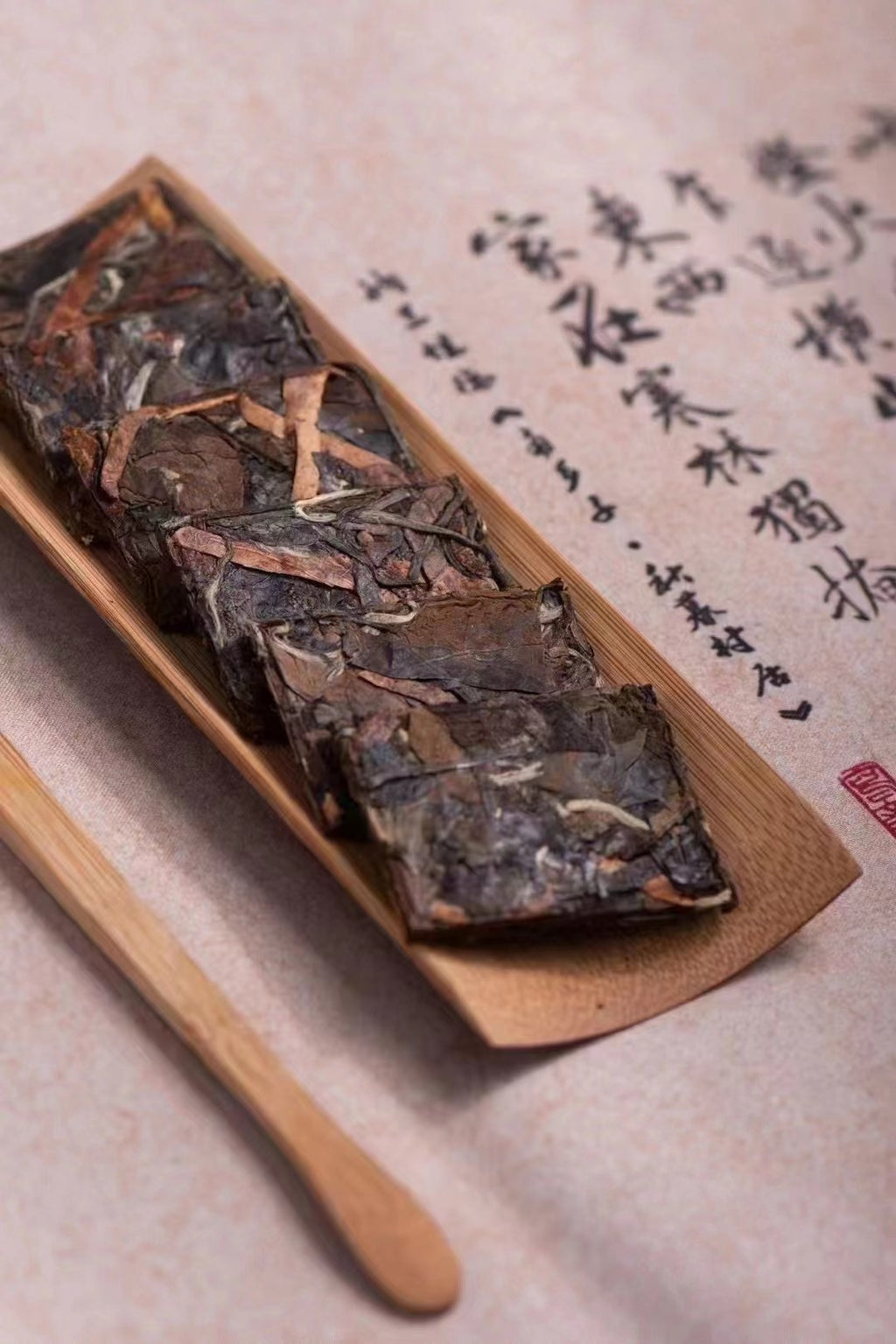 Close-up of compressed Fuding white tea with dried citrus peel