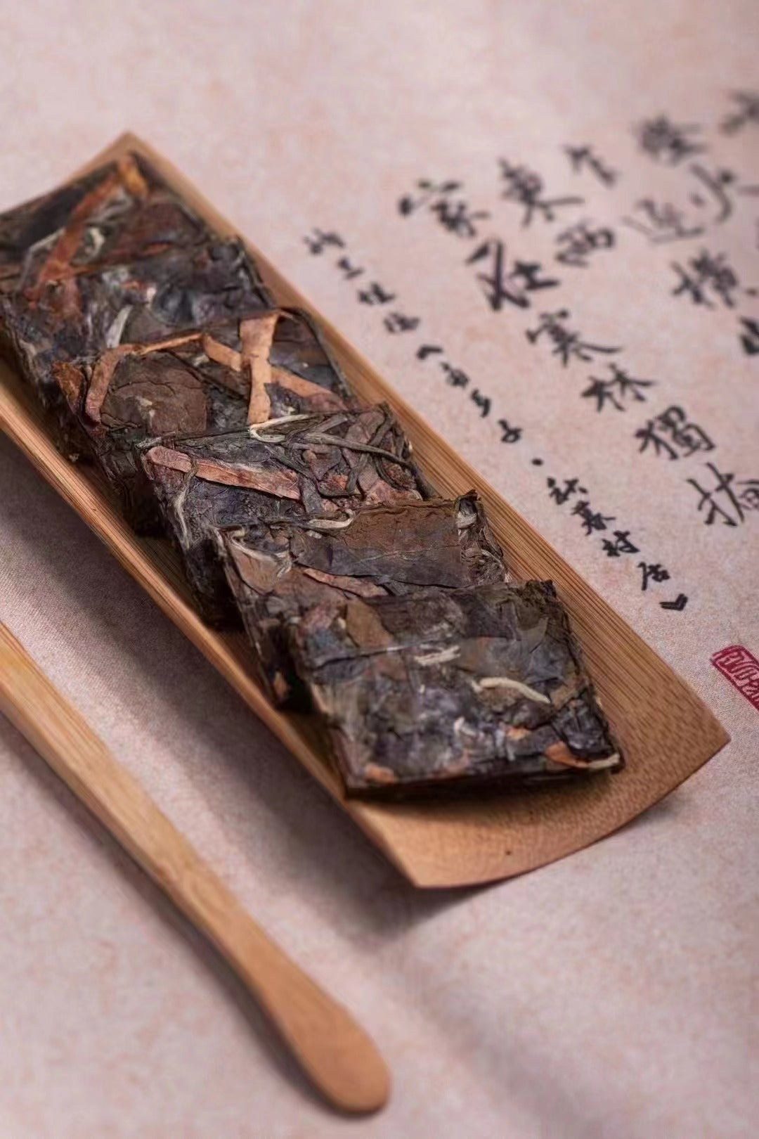Close-up of compressed Fuding white tea with dried citrus peel