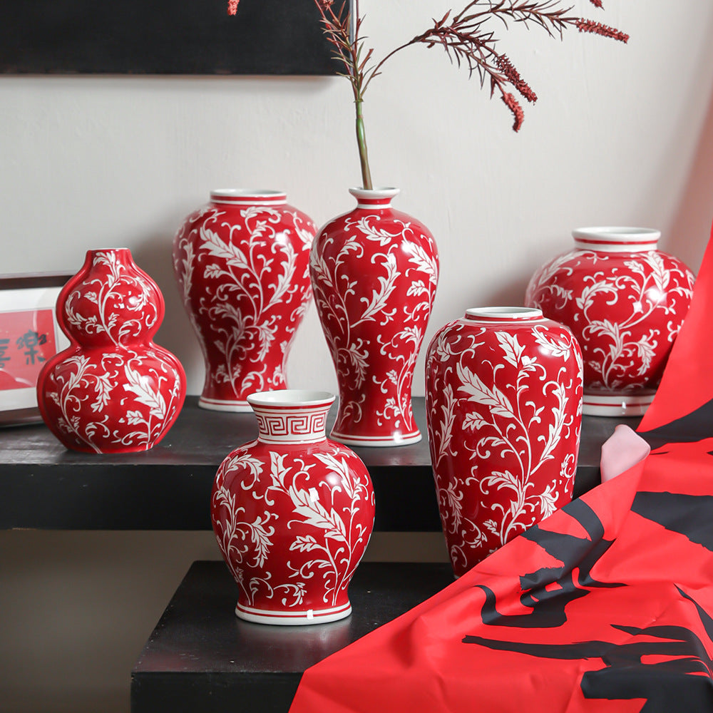 Cinnabar red Chinese ceramic vase collection styled with branches