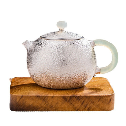 Hand-hammered 999 silver Xishi teapot detail