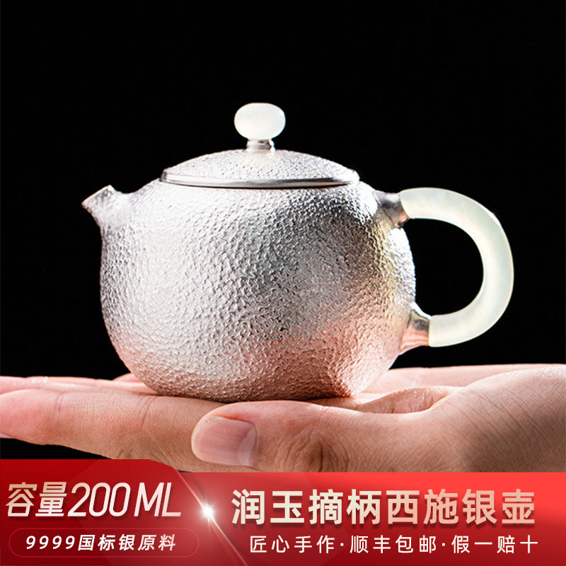 Handmade silver Xishi teapot side view