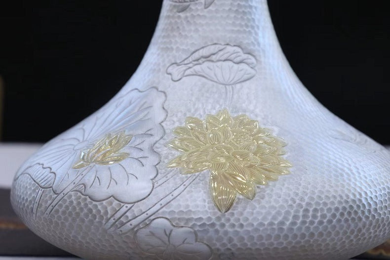 Lotus relief detail on handcrafted 999 fine silver decanter