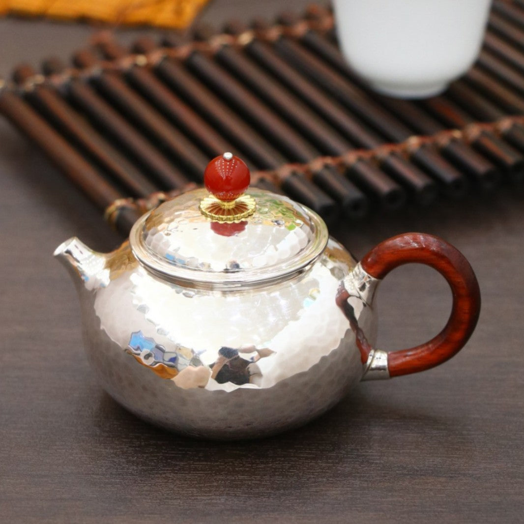 Hand-hammered pure silver mini teapot detail