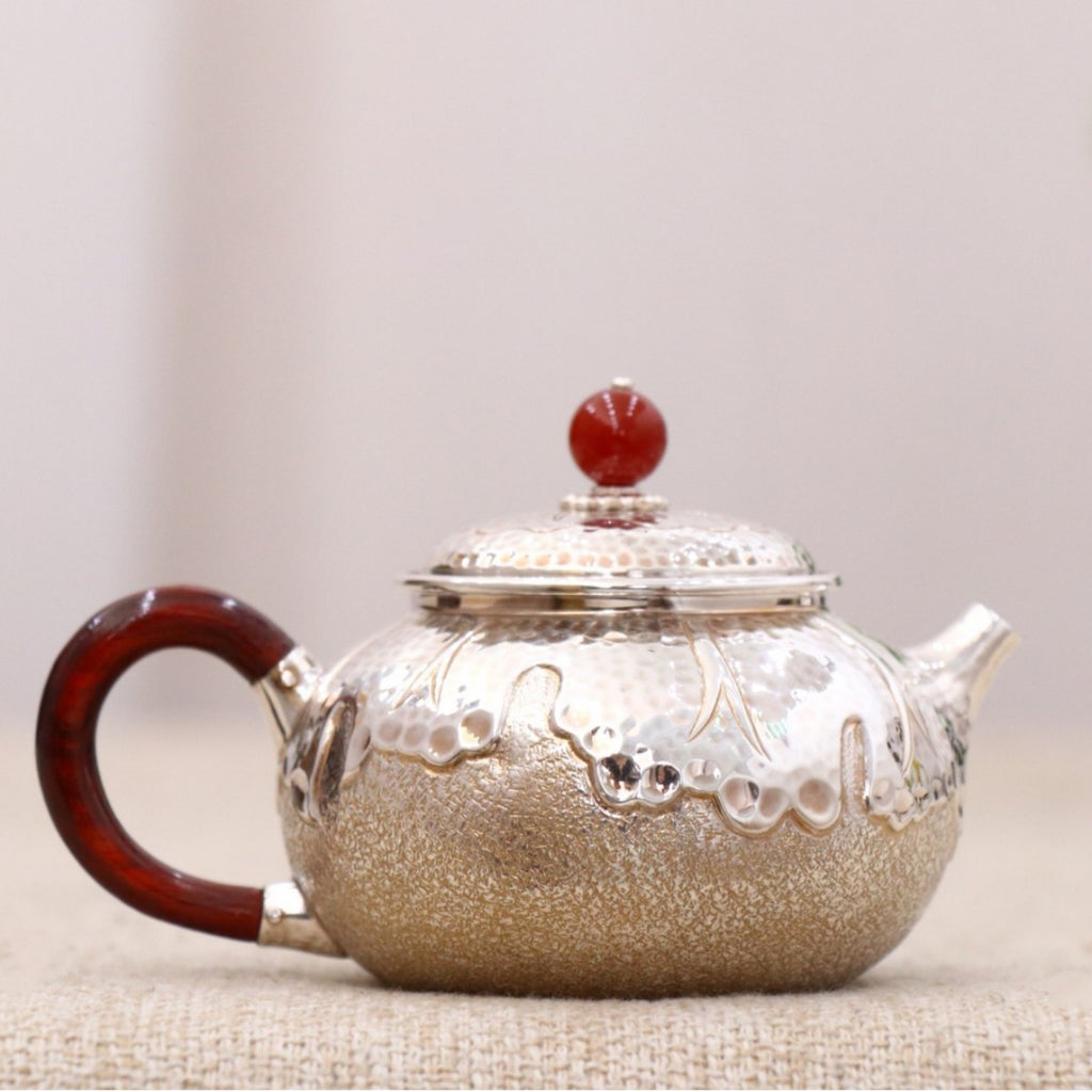 Mini pure silver teapot with red wood handle and red finial