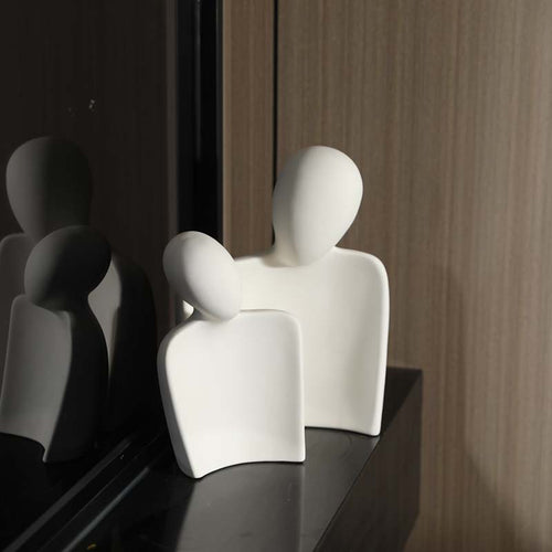 Abstract white ceramic embracing couple sculpture in minimalist New Chinese interior