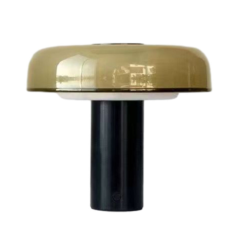 Amber glass dome lamp close view with black cylindrical base