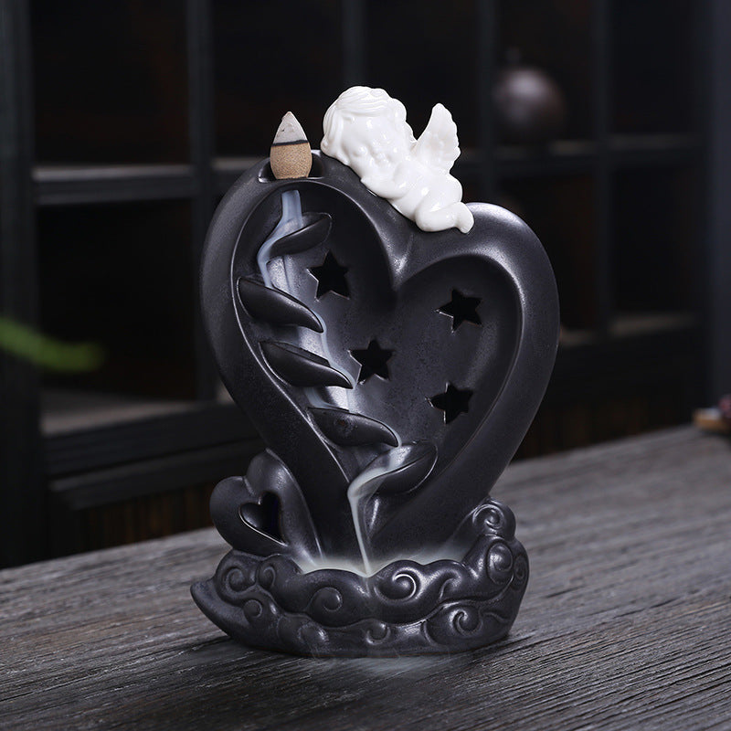 Heart-shaped cherub backflow incense burner alternate view
