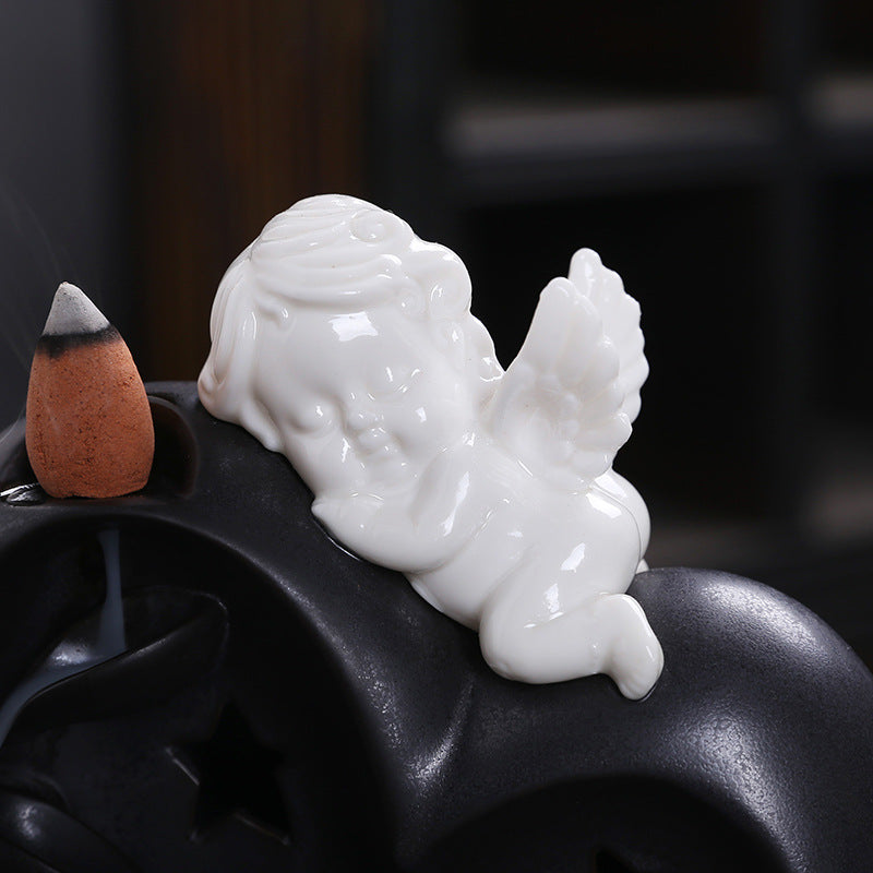 White cherub detail on heart backflow incense burner