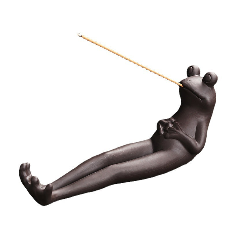 Long-leg frog incense stick holder on white background