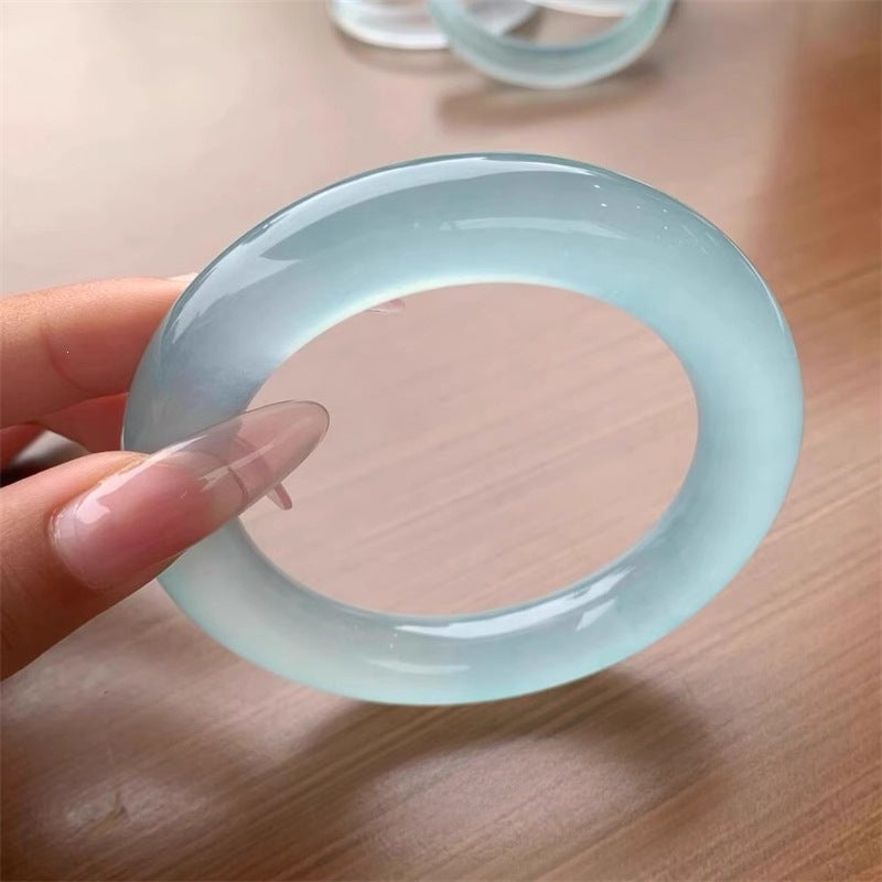 Aqua blue quartzite jade bangle showing icy watery translucency