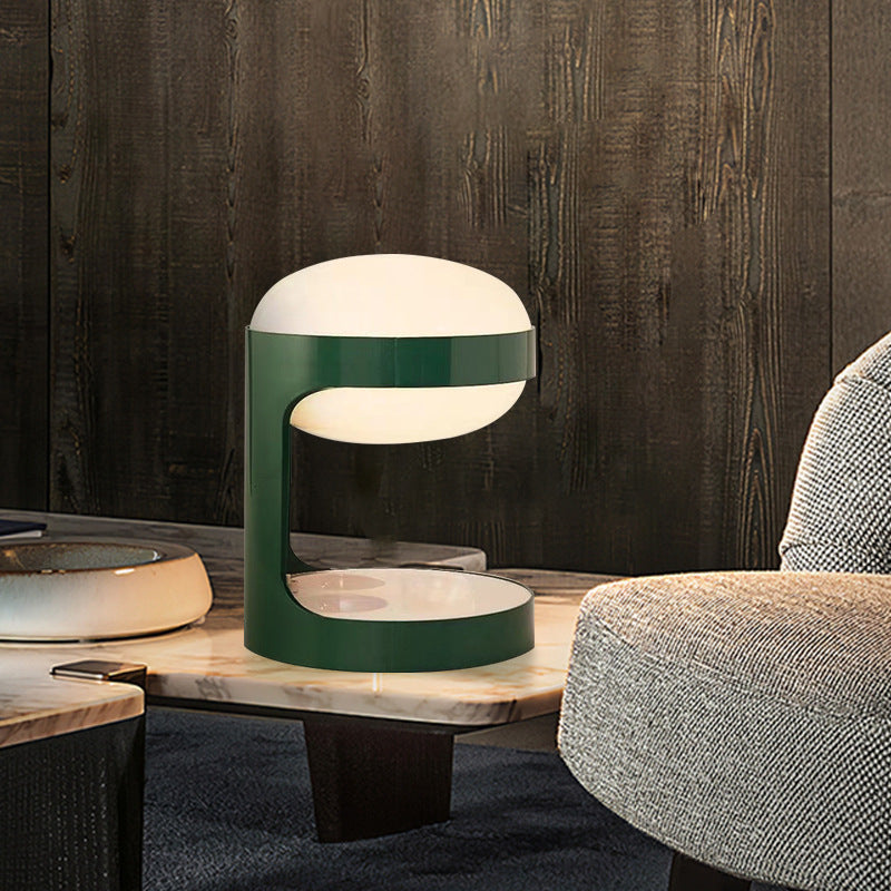 Green postmodern table lamp on a side table in a modern living room
