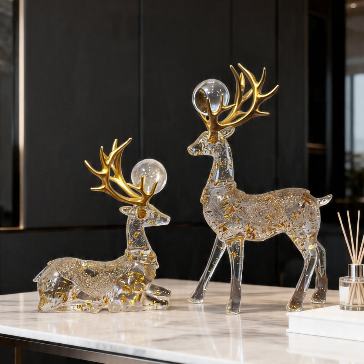 Transparent gold-flake auspicious deer sculpture pair with crystal sphere accents in a modern Chinese living room