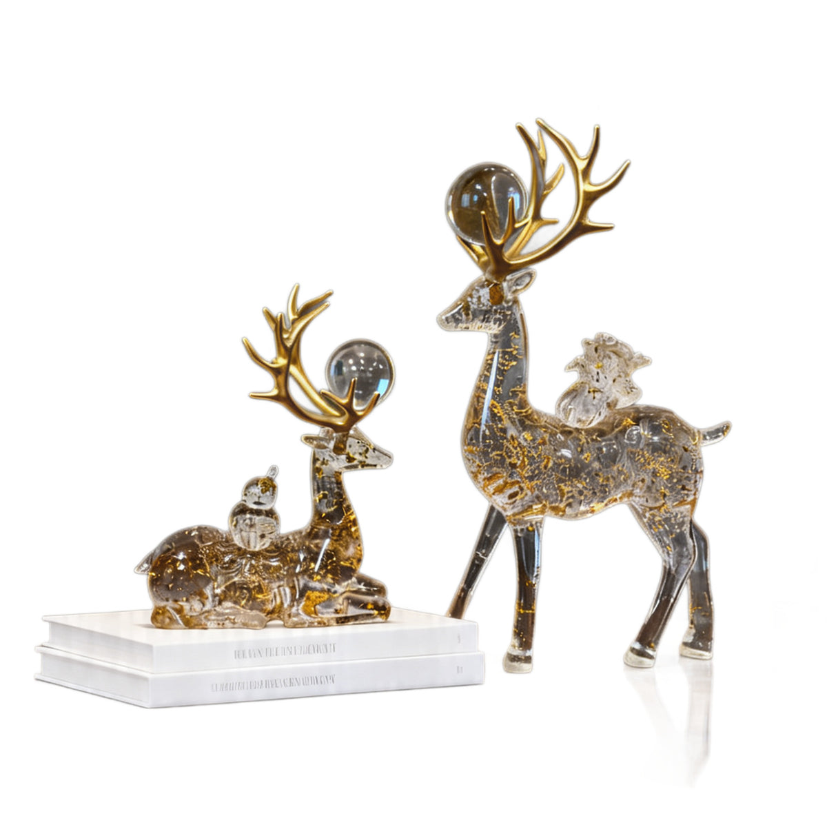 Auspicious deer sculpture pair on a white display surface