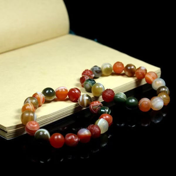 Polished agate bracelet showing varied bead banding and colors
