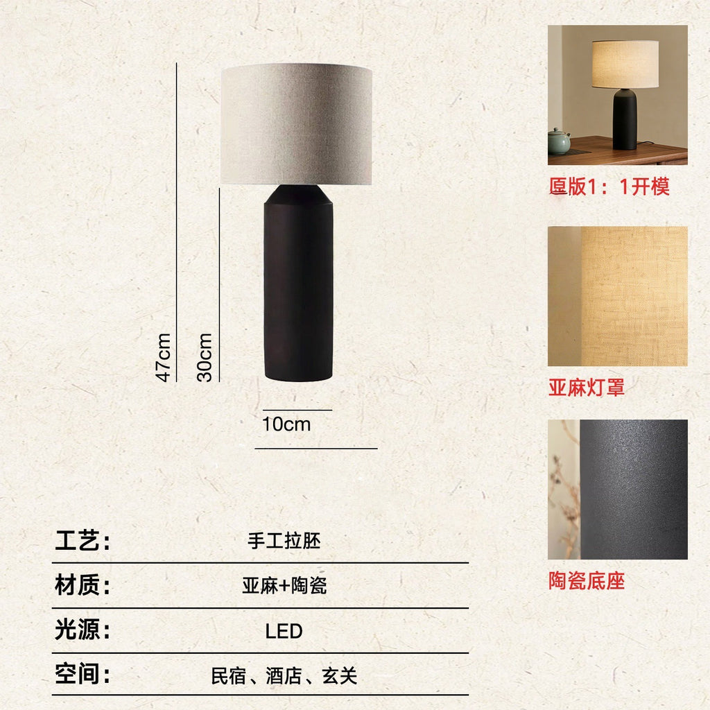 Small black ceramic cylinder lamp approximately 47 cm high with linen shade