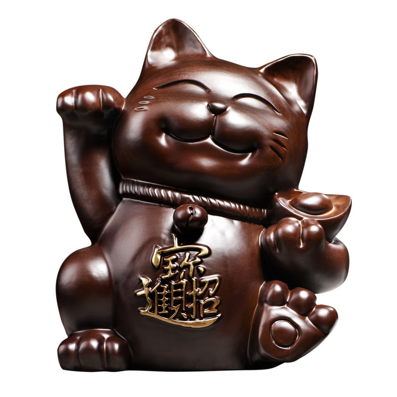 Front view black ebony wood Lucky Cat sculpture with raised paw and Chinese 招财 characters