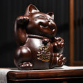 Black ebony wood Chinese Lucky Cat Zhao Cai Mao sculpture with raised paw and 招财 motif for shop office and business opening decor