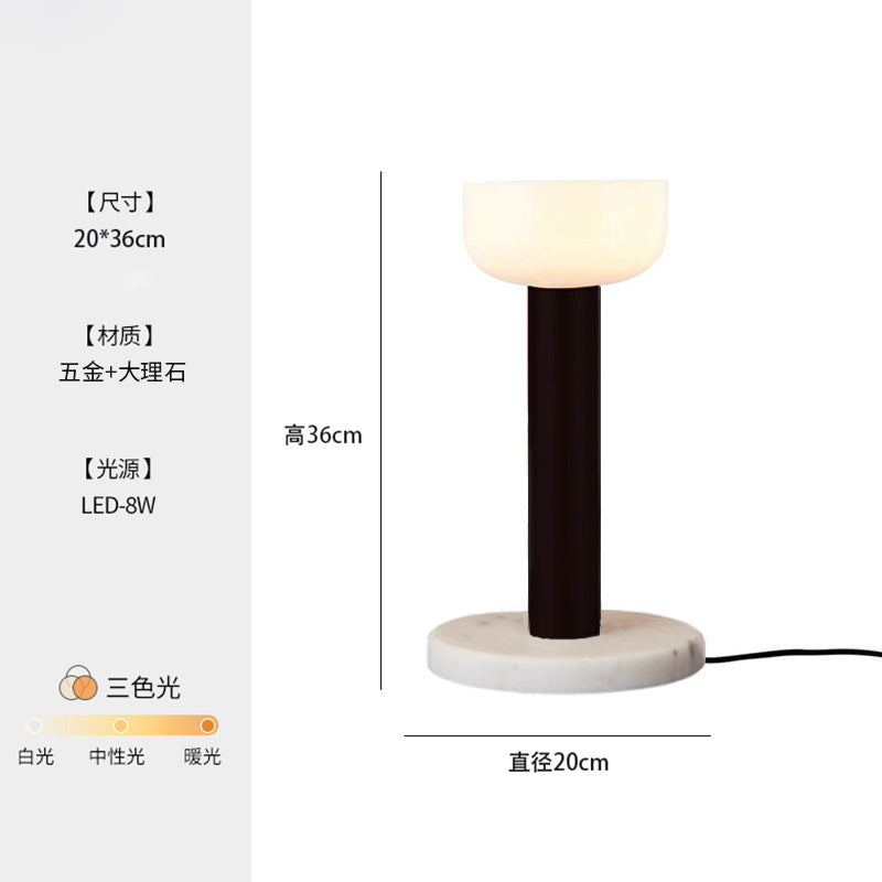 Black macaron LED table lamp with white glowing shade