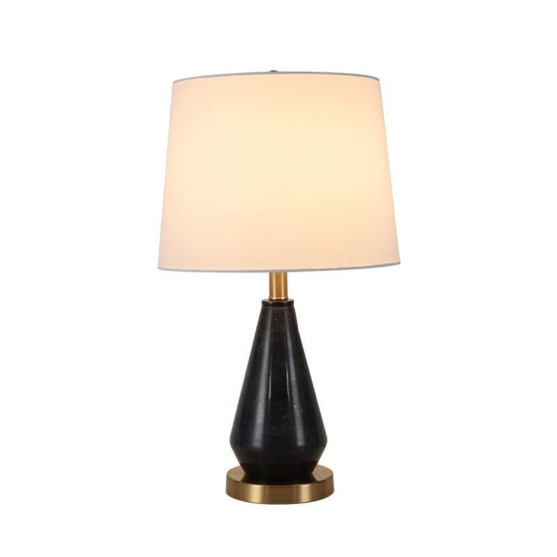 Black marble teardrop table lamp with brass base and linen shade