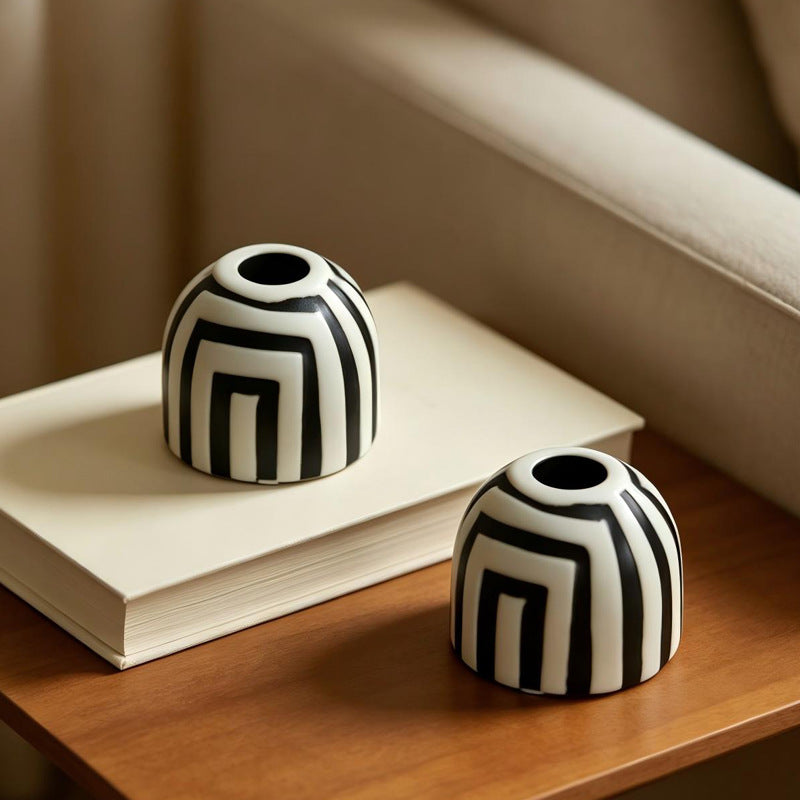 Black and white geometric ceramic candle holders in Nordic inspired design