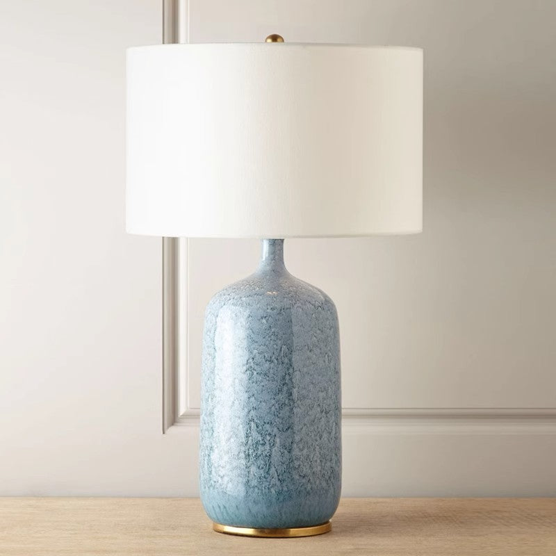 Ice-blue crackle ceramic lamp with brass-tone base and white linen shade